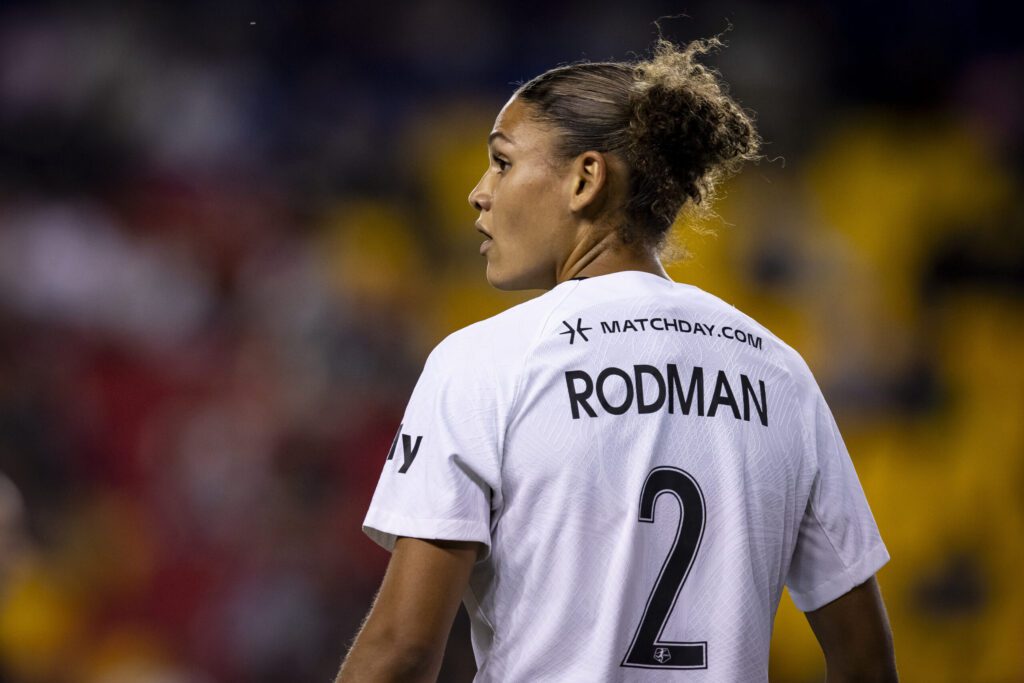 NWSL star Trinity Rodman looks on during a game.