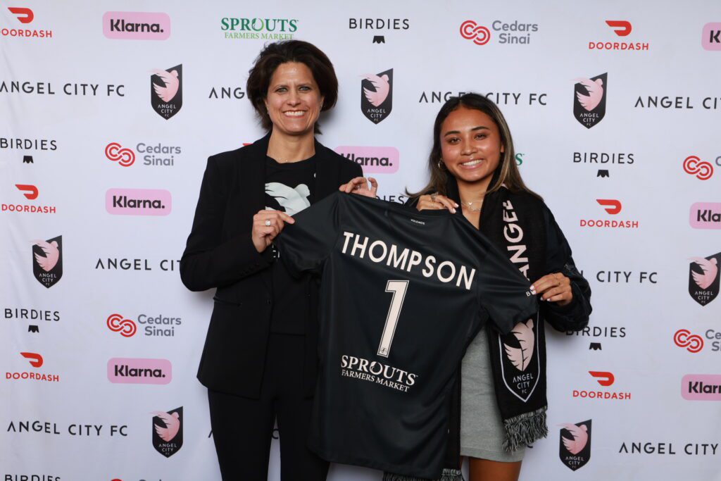 Alyssa Thompson poses with Angel City co-founder and president Julie Uhrman after being selected No. 1 in the NWSL Draft. 