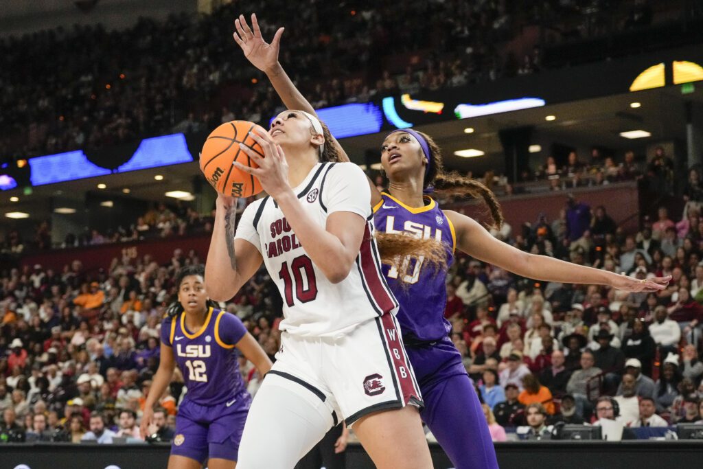 Angel Reese of LSU and Kamilla Cardoso of South Carolina competing at the NCAA basketball SEC Conference Tournament Championship