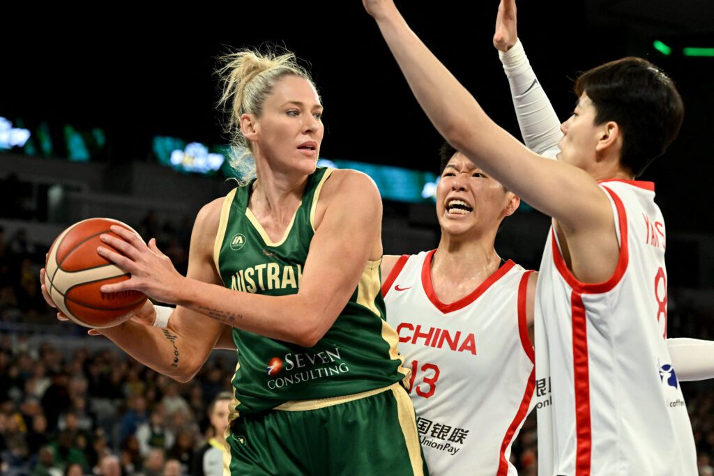Australian basketball player Lauren Jackson on the court against China's Huang Sijing and Yang Shuyu