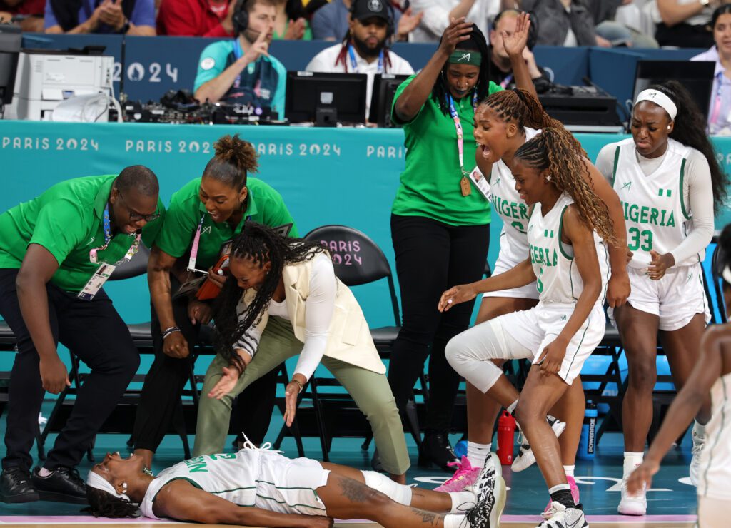 Nigerian basketball player Ezinne Kalu celebrates on the court after beating Australia at the Olympics