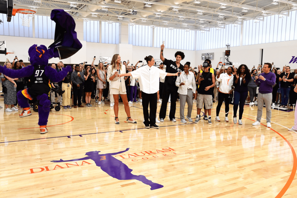 Phoenix mercury players celebrating at the new team training center's diana taurasi courts during wnba all-star weekend