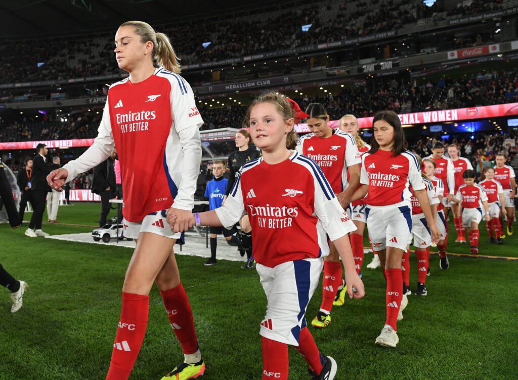 Alessia Russo of Arsenal walks out to the pitch with a mascot before the match between A-League All Stars Women and Arsenal Women in Australia