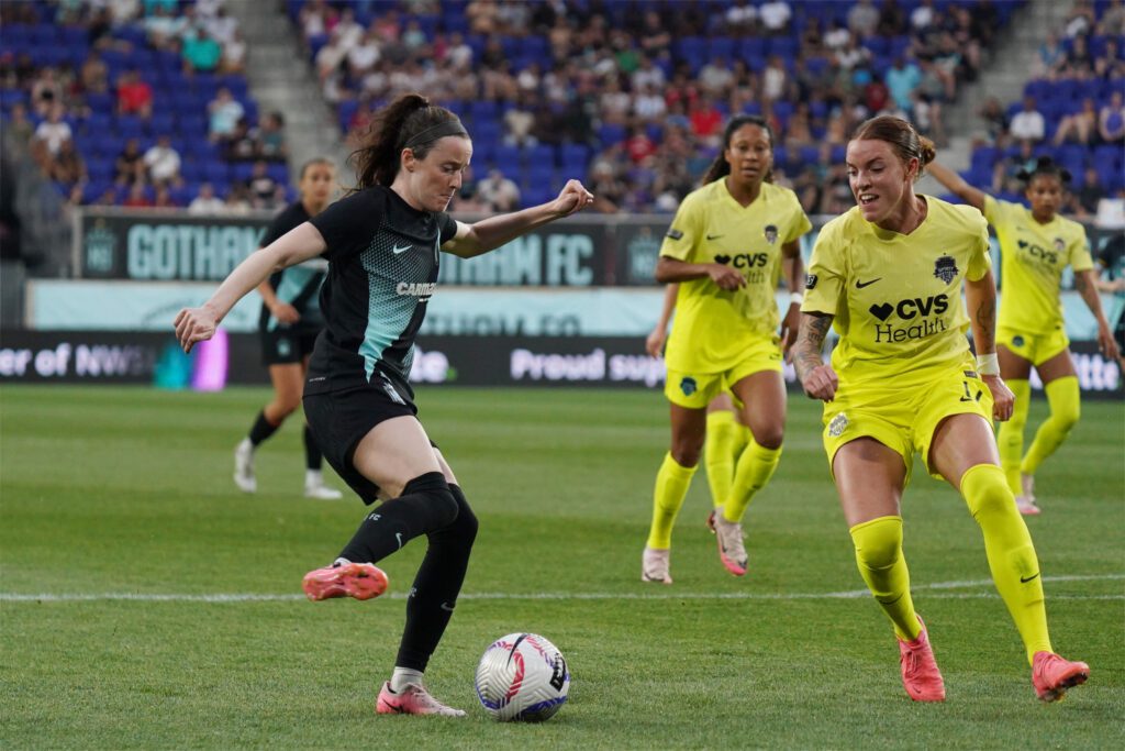 NJ/NY Gotham FC midfielder Rose Lavelle (16) plays the ball defended by Washington Spirit midfielder Hal Hershfelt (17) in the second half at Red Bull Arena. 