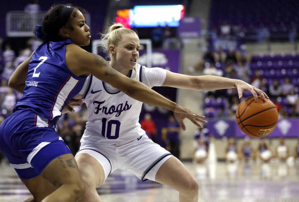 Sweet 16 newcomer TCU star Hailey Van Lith battles Houston Christian's Victoria Dixon for the ball.