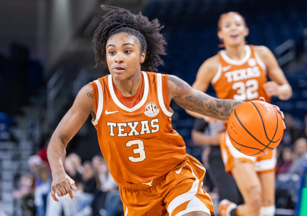 Rori Harmon #3 of the Texas Longhorns brings the ball up court during an NCAA college basketball game.