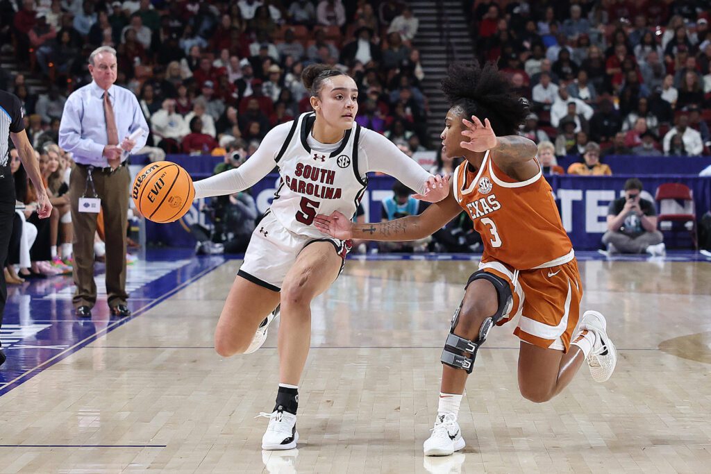 Sweet 16 team South Carolina Gamecocks guard Tessa Johnson (5) works the ball against Texas Longhorns guard Rori Harmon (3) during the championship game of the SEC women's college basketball tournament between the Texas Longhorns and the South Carolina Gamecocks on March 9, 2025 at Bon Secours Wellness Arena in Greenville, S.C.