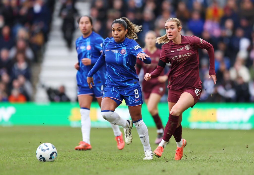 Chelsea's Catarina Macario and Man City's Jill Roord chase the ball during the 2025 League Cup final.
