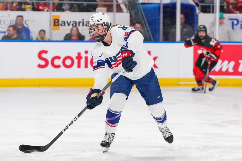Team USA's Kelly Pannek advances the puck up the ice during a 2023 game against Canada.