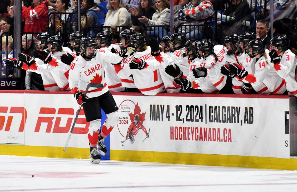 Julia Gosling celebrates a goal with Canada's bench during the 2024 IIHF World Championship gold medal game.