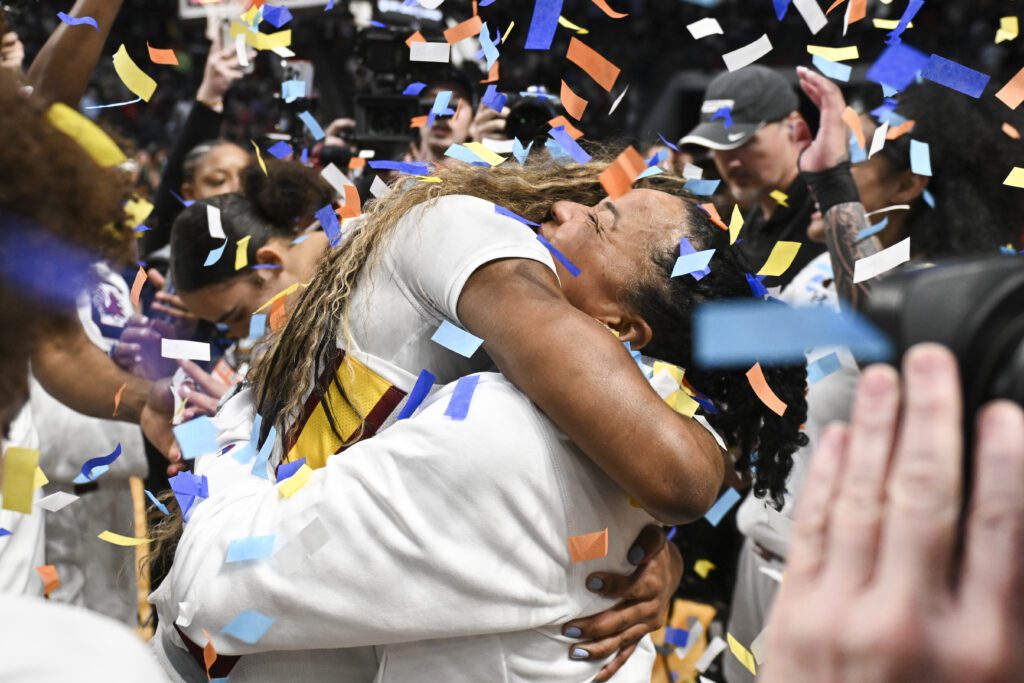Bree Hall #23 hugs Dawn Staley Head coach of the South Carolina Gamecocks after defeating the Duke Blue Devils.