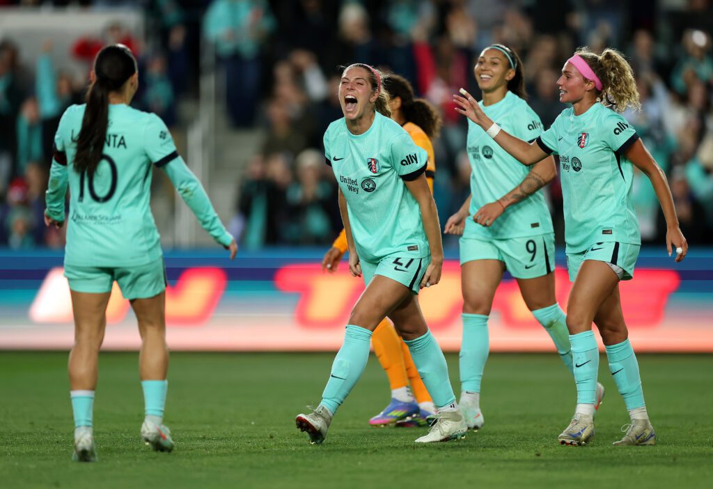 Kansas City's Kayla Sharples celebrates a goal with her teammates on Saturday.