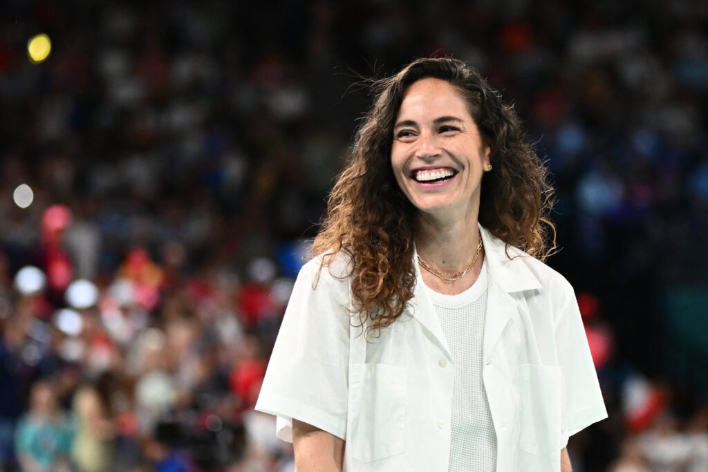 Retired WNBA and Team USA star Sue Bird smiles before the 2024 Olympic gold-medal game.