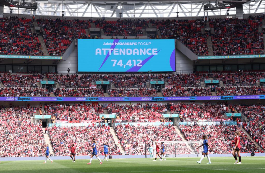 A screen shows the 74,412 attendance at Wembley Stadium during the 2025 FA Cup final.