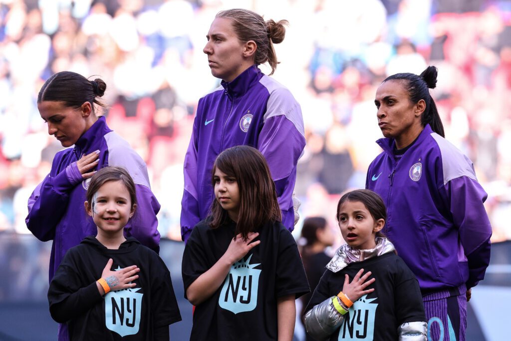 Haley McCutcheon #2, 2025 Euros goalkeeper Anna Moorhouse of England and Marta #10 of Orlando Pride line up prior the NWSL match.