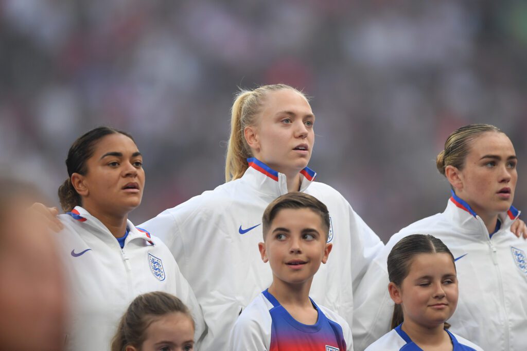 2025 Euros players Jess Carter, Esme Morgan and Grace Clinton of England sing their national anthem prior to the UEFA Women's Nations League 2024/25 Grp A3 MD5 match.