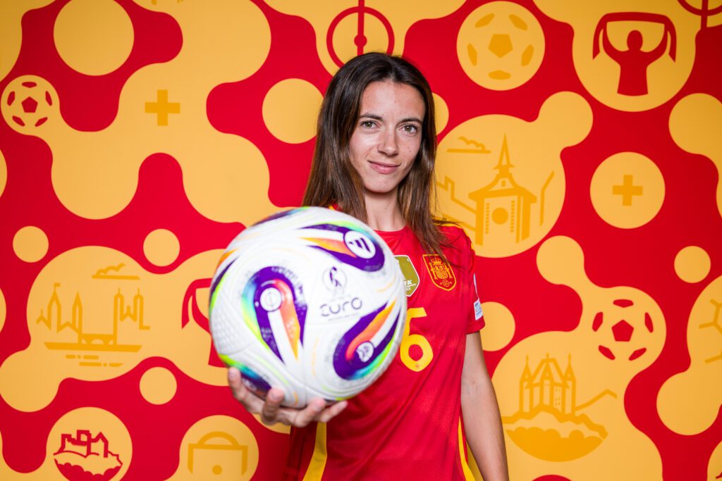 Spain Euros star Aitana Bonmatí holds a soccer ball in an official 2025 Euro photo.