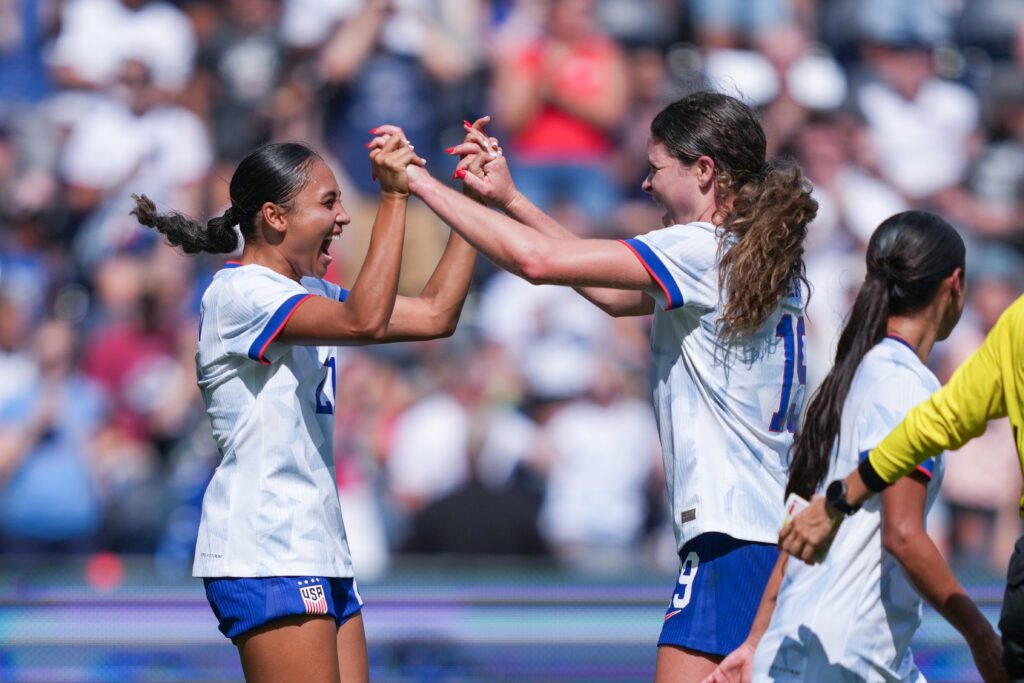 USWNT attacker Alyssa Thompson celebrates her goal with teammate Emma Sears during a 2025 friendly against Ireland.