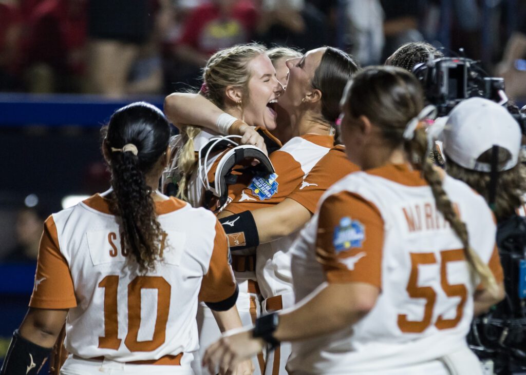 The Texas Longhorns celebrate their 2025 WCWS championship series Game 1 win over Texas Tech.