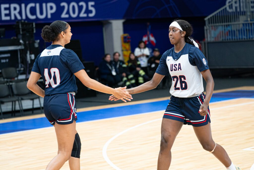 Hannah Stuelke and Flau'Jae Johnson high-five during a Team USA training session at the 2025 FIBA AmeriCup in Santiago, Chile.
