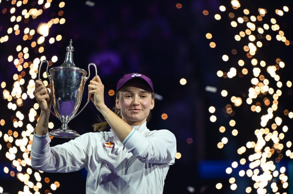 Kazakhstan tennis star Elena Rybakina lifts the Billie Jean King Trophy after winning the 2025 WTA Finals.