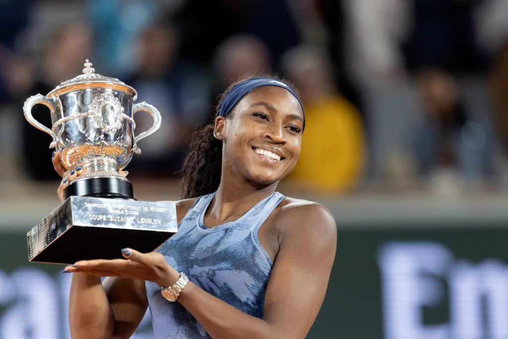 US tennis star Coco Gauff poses holding her 2025 French Open trophy.