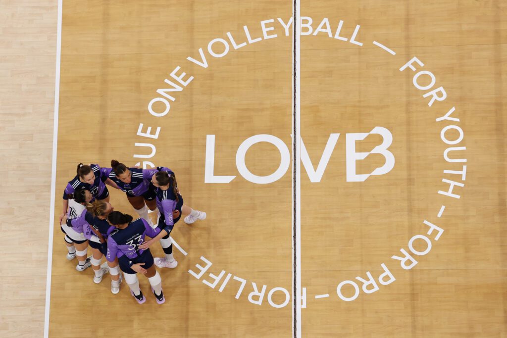 An overhead view of LOVB Austin huddling on the court during the 2025 championship game.