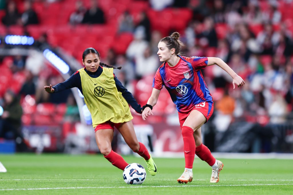 Emily Fox #23 of the United States is marked by Alyssa Thompson #7 during warmups prior to the Women's international friendly between England and the USA at Wembley Stadium on November 30, 2024 in London, England.