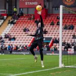 Phallon Tullis-Joyce of Manchester United warms up during the Barclays Women's Super League match between Manchester United and Liverpool at Progress with Unity Stadium on February 01, 2026 in Leigh, England.