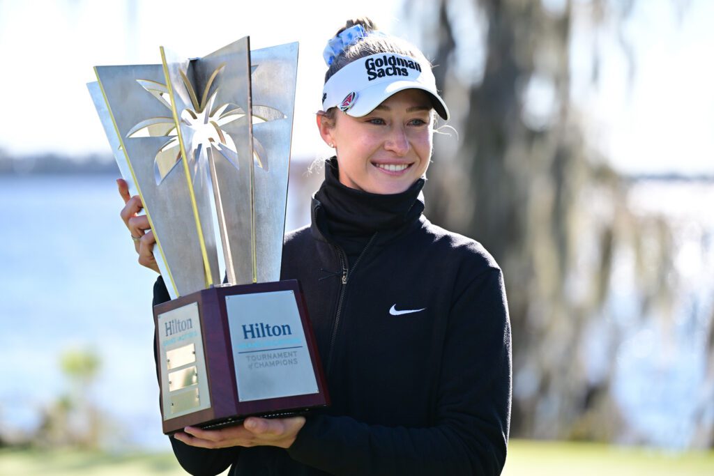 US golf star Nelly Korda poses holding her 2026 HGV Tournament of Champions trophy.