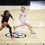 Vanderbilt guard Mikayla Blakes drives around Oklahoma guard Payton Verhulst during a 2025/26 NCAA basketball game.