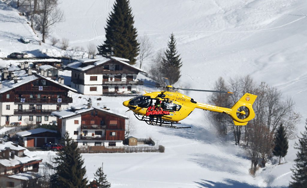 A mountain rescue helicopter is seen rescuing Lindsey Vonn of Team United States after she crashed during the Women's Downhill on day two of the Milano Cortina 2026 Winter Olympics at Tofane Alpine Skiing Centre on February 08, 2026 in Cortina d'Ampezzo, Italy.