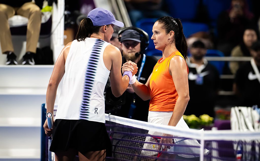 Iga Swiatek of Poland and Daria Kasatkina of Australia shake hands at the net after the third round on Day Four of the Qatar TotalEnergies Open, part of the Hologic WTA Tour at Khalifa International Tennis and Squash Complex on February 11, 2026 in Doha, Qatar.