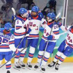 USA Hockey defender Laila Edwards celebrates her first Olympic goal with her teammates at the 2026 Winter Games.