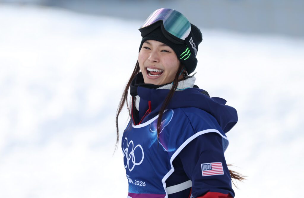 USA snowboarder Chloe Kim smiles during the halfpipe qualification round at the 2026 Winter Olympics.
